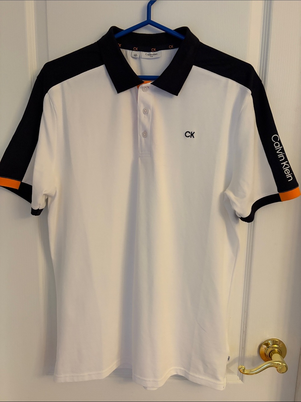 NWOT Calvin Klein White Polo with Navy Collar and Orange Accents